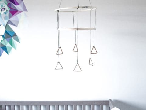 This modern DIY mobile will make any nursery feel a little more custom. And it's so easy!