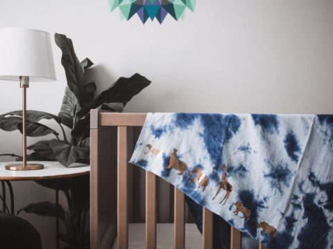 This DIY muslin swaddle blanket has a super fun safari theme making it perfect for any safari themed baby shower or any animal loving mama. 