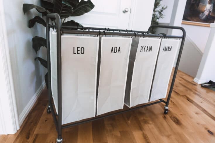 This laundry sorter is moveable and customizable using infusible ink! You can use regular iron on as well. It has helped our laundry situation so much.
