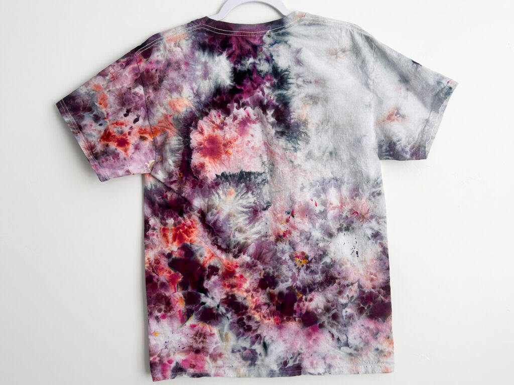 Back view of finished heart tie dye shirt using sinew and ice dye technique