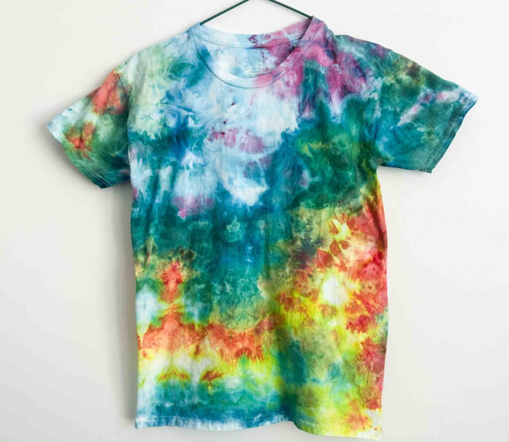 Rainbow ice tie dye shirt with scrunch folds in teal, yellow, red, and purple