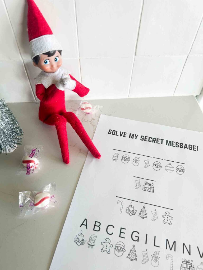 Elf on the Shelf with Christmas secret message code activity sheet and holiday candies