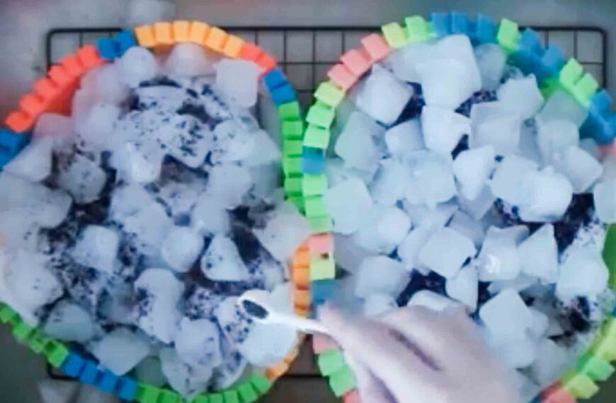 Sprinkling powdered dye on top of ice cubes for ice dye experiment, side by side with dye placed under ice
