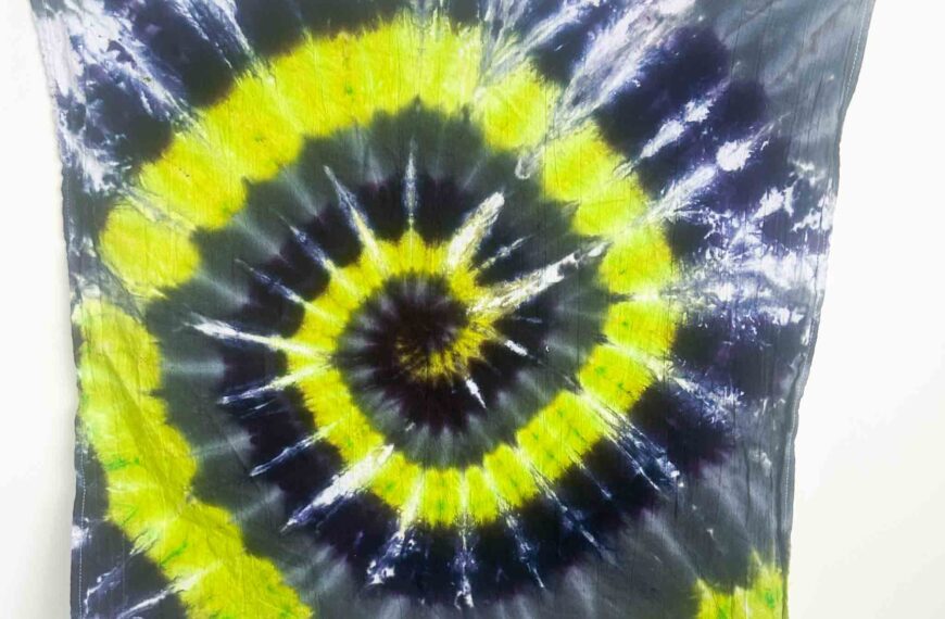 Finished Halloween spiral tie dye towel with neon yellow, purple, and black rings for a bold festive design