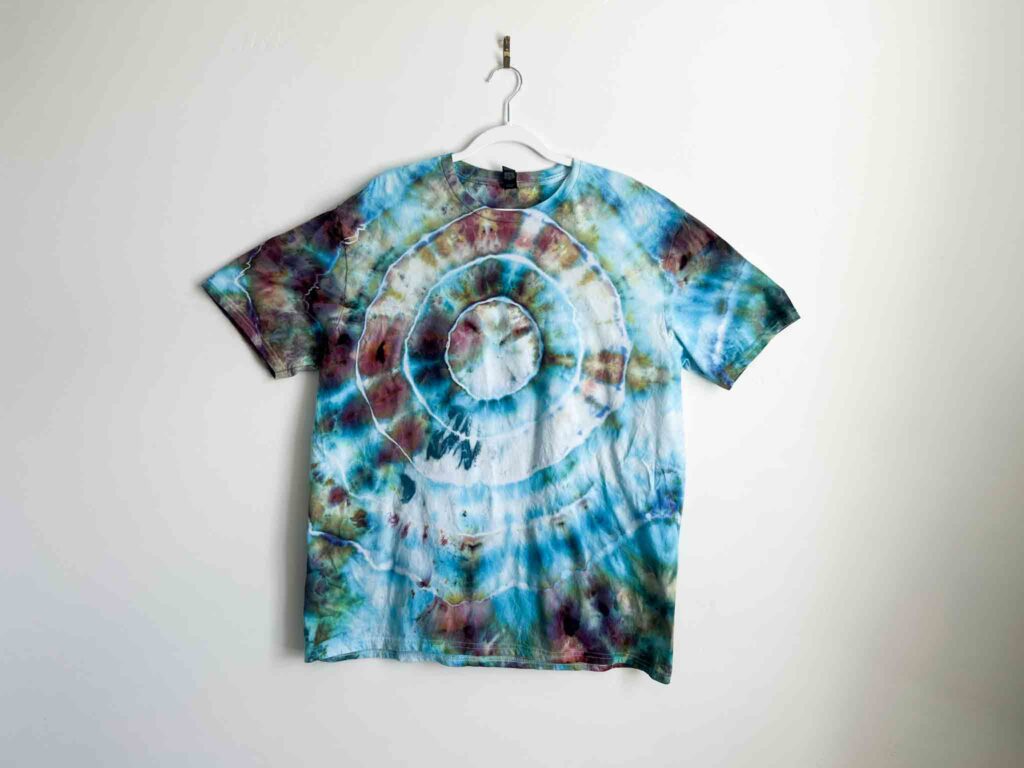 Bullseye tie dye shirt featuring concentric circles in shades of blue, teal, and purple.