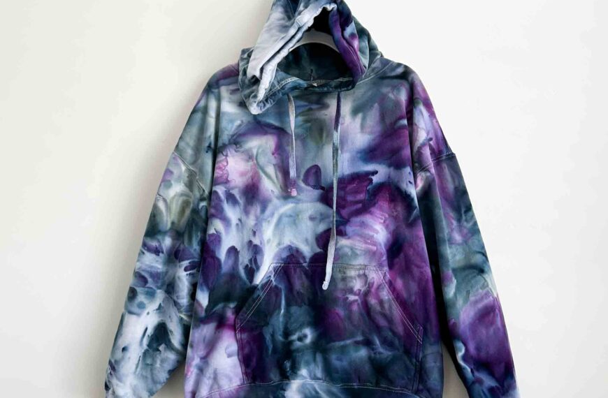 Front view of a purple and gray tie dye hoodie created with a tall deep scrunch technique