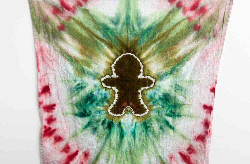 Finished gingerbread man Christmas tie dye towel with red, green, and brown holiday colors