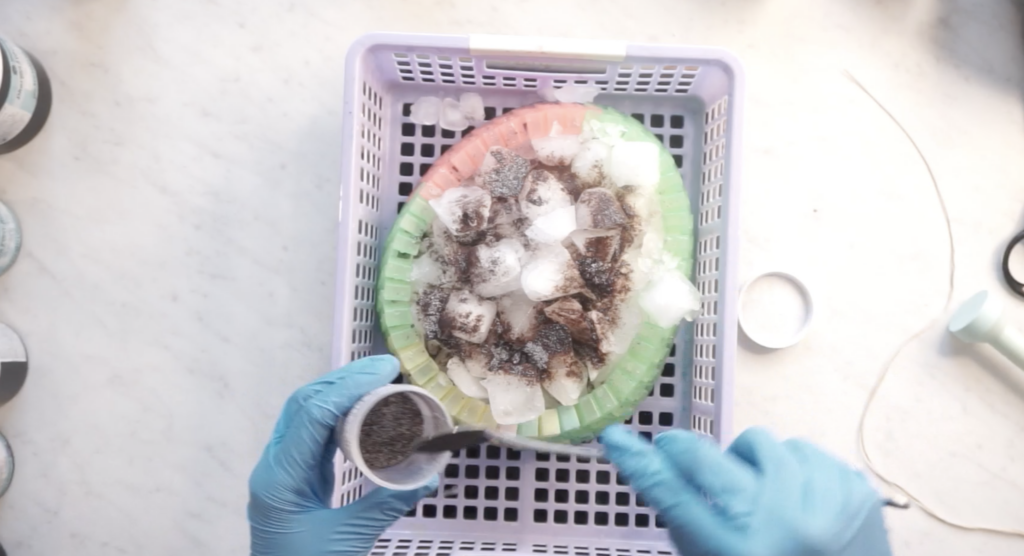 Ice dyeing rayon fabric with ice and fiber reactive dye applied to a mandala fold