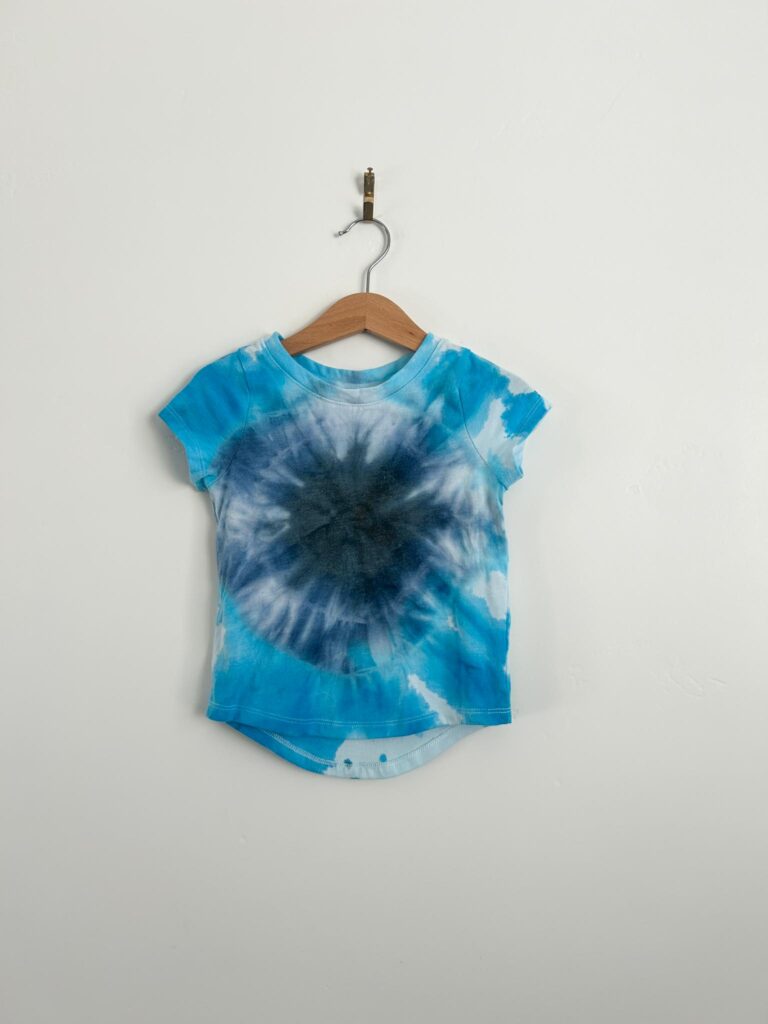 Blue and navy bullseye tie dye t-shirt made with the Create Basics 18 bottle tie dye party tub from Walmart