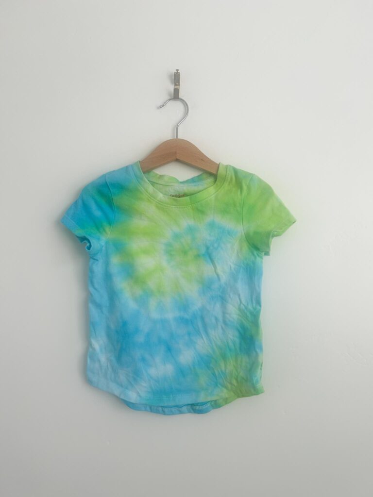 Blue and green spiral tie dye t-shirt made with the Create Basics tie dye party tub
