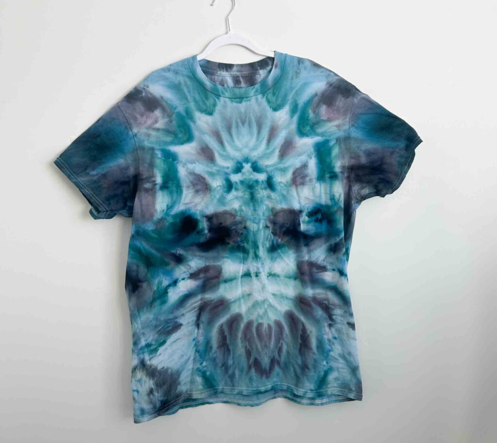 George brand white t-shirt from Walmart tie dyed in a blue and teal deity roll pattern