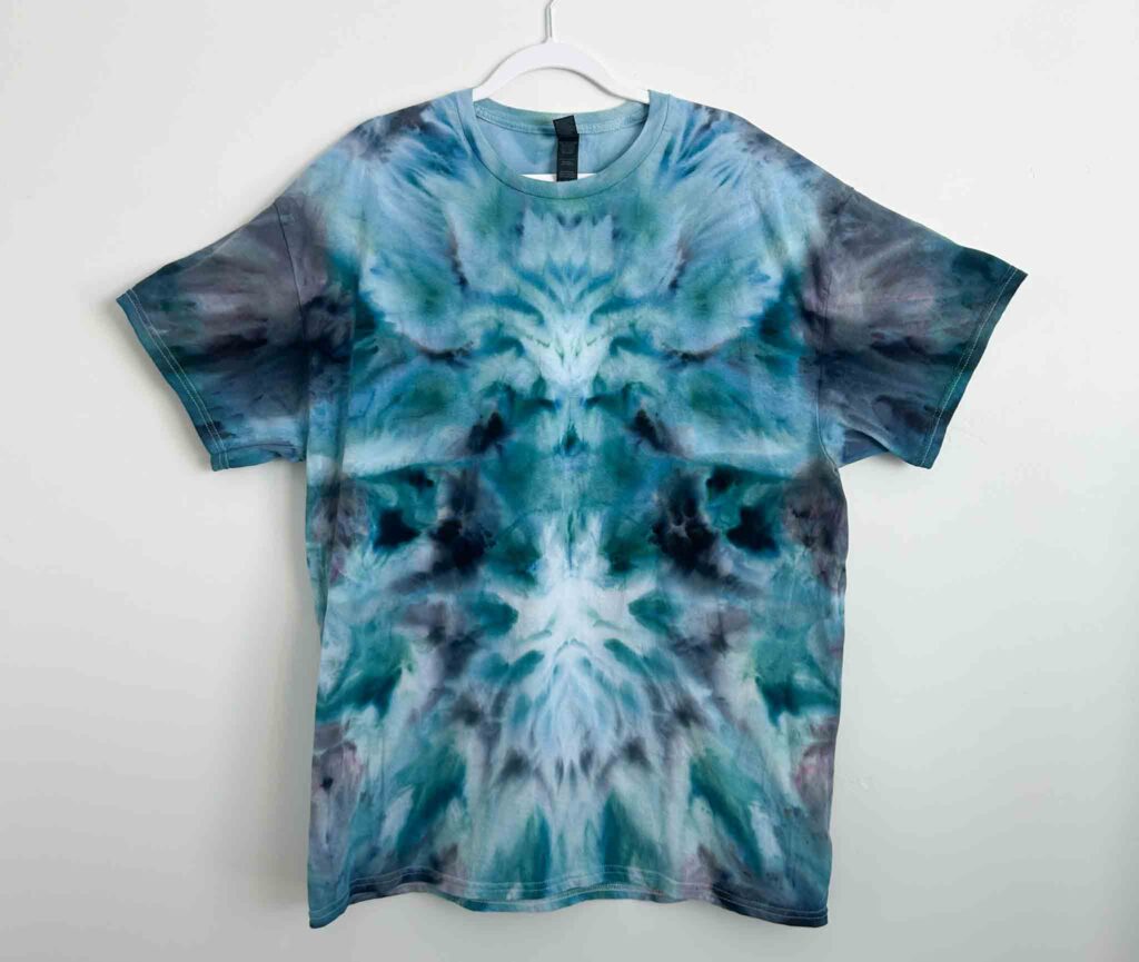 Gildan Light Cotton white t-shirt tie dyed in a blue and teal deity roll pattern