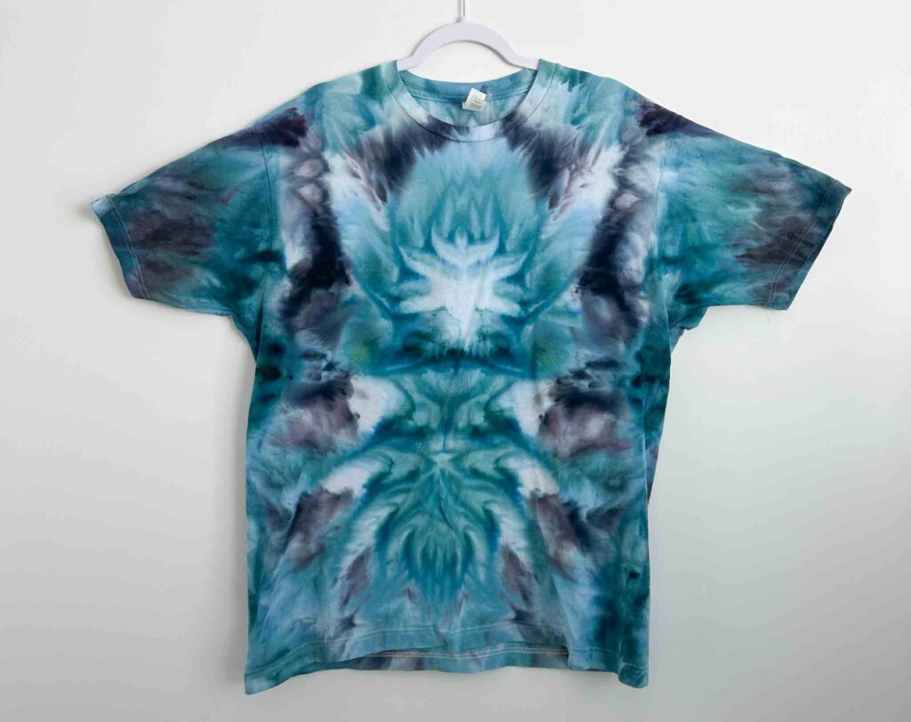 Tultex Fine Jersey white t-shirt tie dyed in a blue and teal deity roll pattern