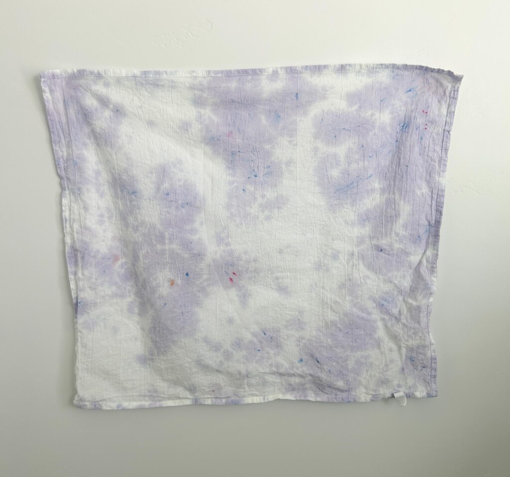 Pastel Wisteria one color tie dye on a white towel, a soft light purple scrunch