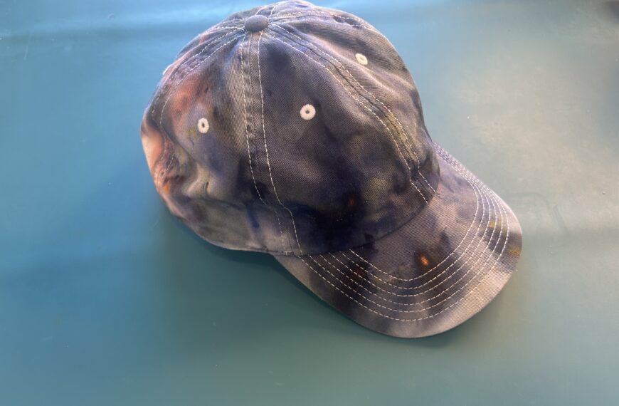 Finished ice dyed baseball cap in moody navy, purple, and brown tones using Pillars of Creation dye