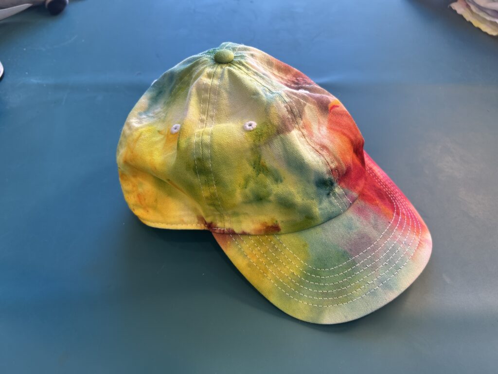 hat-finished.jpgFinished rainbow ice dyed baseball cap with green, yellow, orange, and red blending across the crown and bill