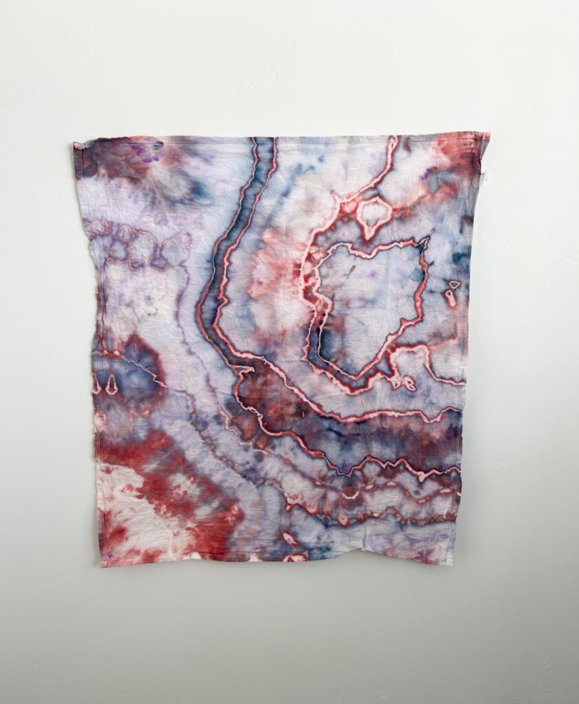 Crimson Haze Dharma ice dye swatch in cranberry red and smoky blue-gray
