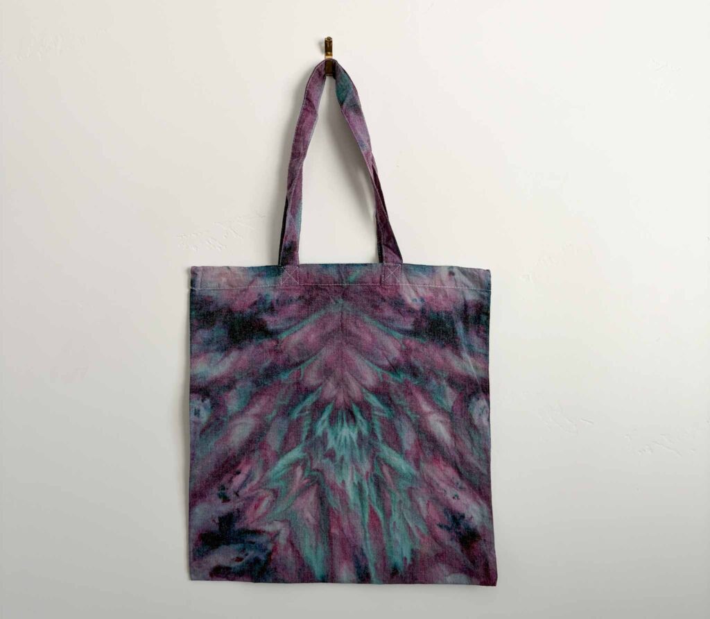 Finished ice dye tote bag using the psychedelic roll fold in purple and teal