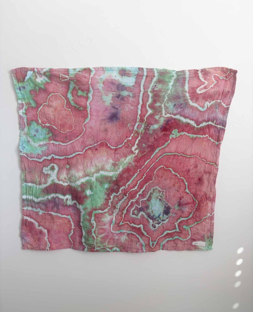 Geode tie dye towel in Dharma x Dalula Mint Berry, a raspberry pink ice dye splitting into mint green