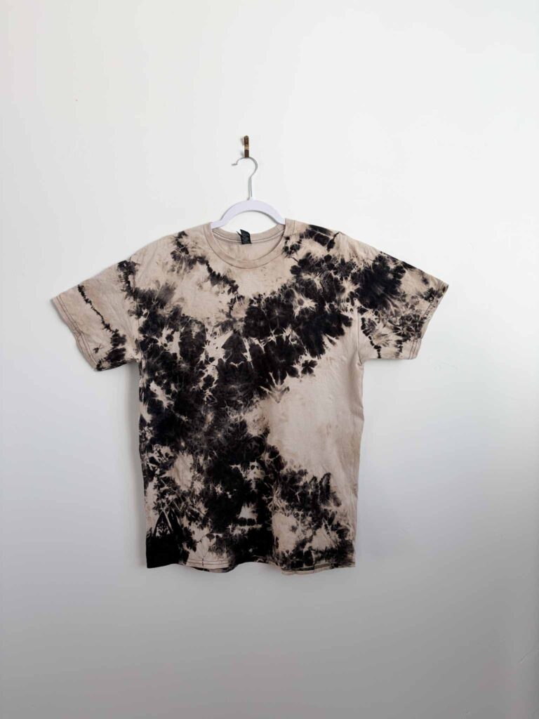 Black shirt with a crumple reverse tie dye pattern made using Out White Brite